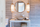 Add Contemporary Bath Lights Beside Round Mirror for Stylish Look